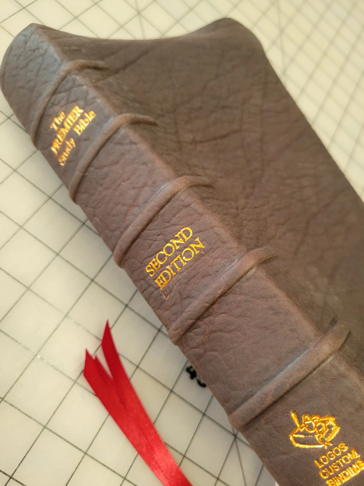 Raised wrap-around ribs with custom spine imprinting.