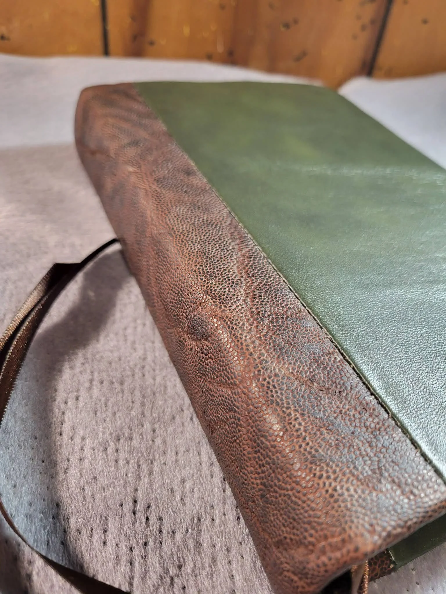 Dual leather green cowskin with genuine elephant spine.